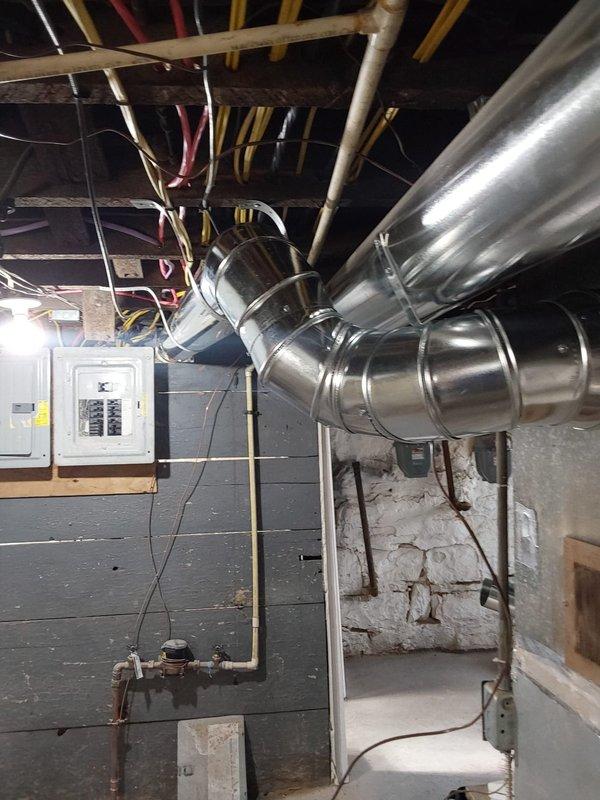 Successfully repaired a 7" ductwork run that had become disconnected in the basement utility area. Properly secured the metal duct sections with connecting bands at the joints, ensuring proper airflow through the system and restoring full functionality to the HVAC infrastructure.