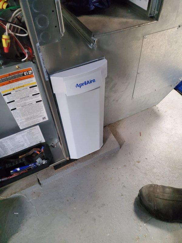 Successfully installed new high-efficiency furnace system with AprilAire humidifier and air cleaner components. Modified existing return drop to accommodate filter installation. Retained and reconnected existing AC unit to complete the integrated HVAC system upgrade.