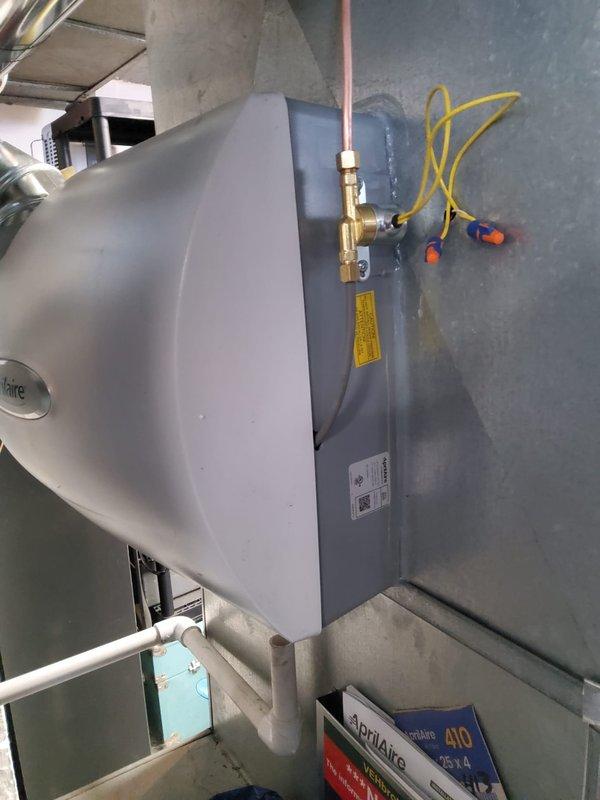 Successfully installed new high-efficiency furnace system with AprilAire humidifier and air cleaner components. Modified existing return drop to accommodate filter installation. Retained and reconnected existing AC unit to complete the integrated HVAC system upgrade.