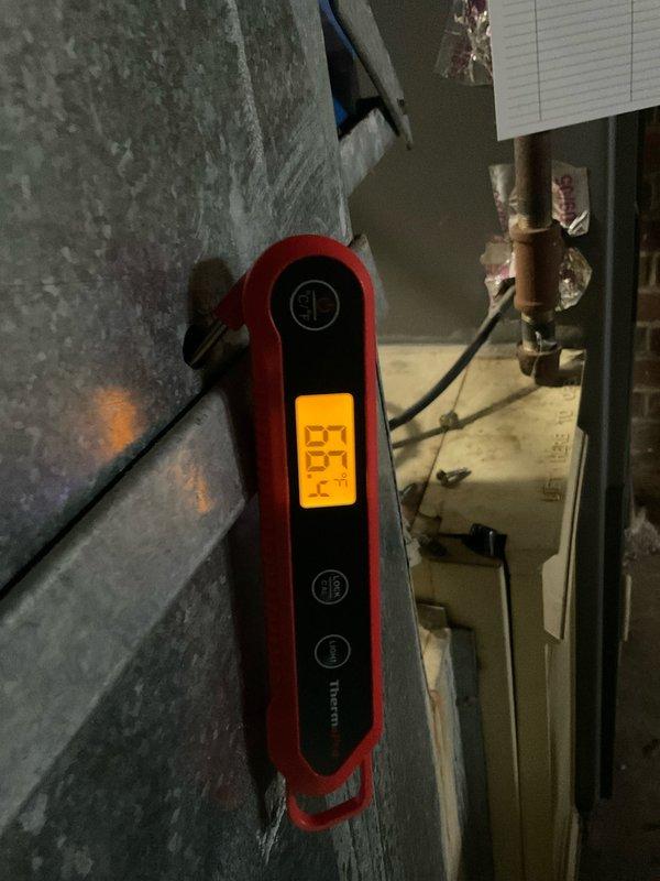 Completed heating system maintenance per Home Plan agreement. Conducted temperature diagnostics (measured 27.4°) of heating components and performed electrical testing with multimeter showing 75.16V reading. Inspected copper piping and associated mechanical components to ensure proper system operation.
