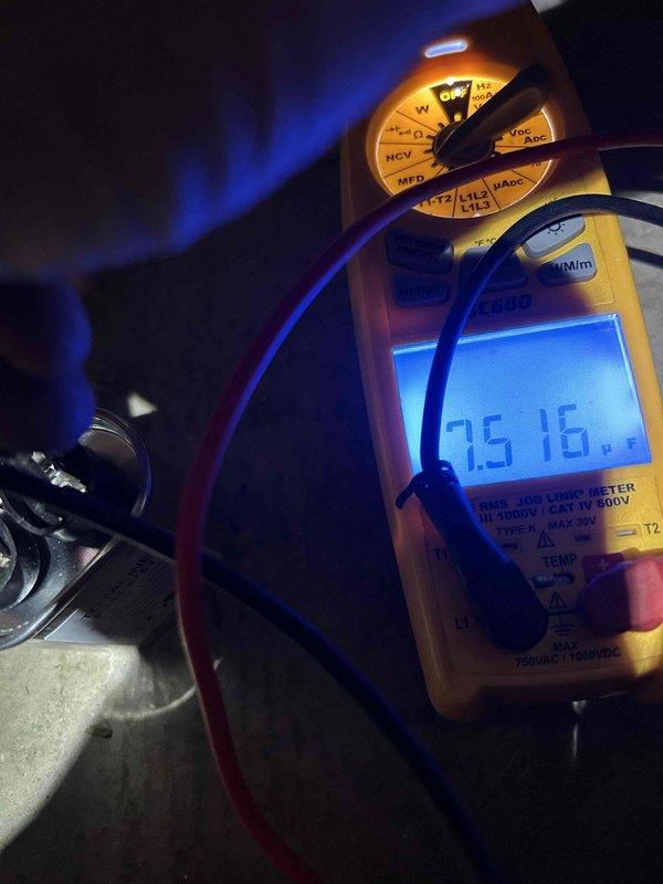 Completed heating system maintenance per Home Plan agreement. Conducted temperature diagnostics (measured 27.4°) of heating components and performed electrical testing with multimeter showing 75.16V reading. Inspected copper piping and associated mechanical components to ensure proper system operation.