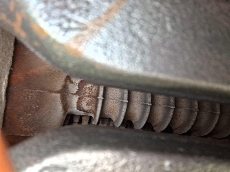 Performed routine maintenance service on 20+ year old natural gas steam boiler. Inspected heat exchanger showing normal aging with some rust and soot accumulation. Cleaned accessible components and verified proper operation of system.