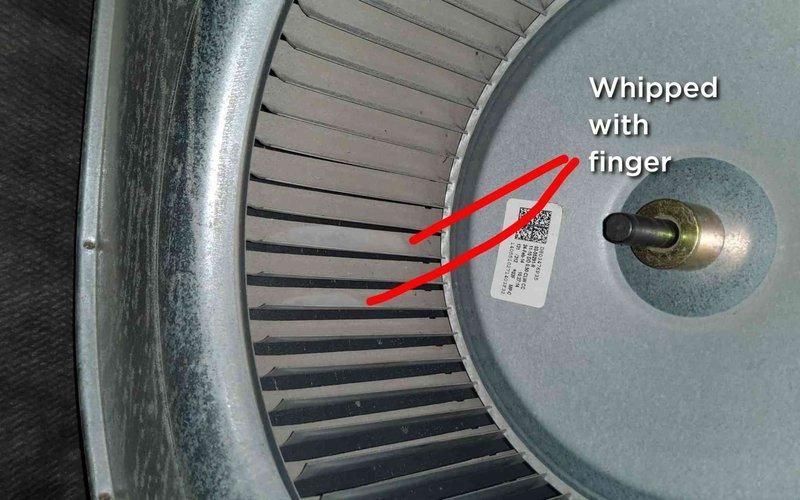 Performed heating tune-up on home plan customer's heat pump furnace. Inspected burner assembly which showed proper blue flame pattern and even ignition. Found minor damage to blower wheel where blades appeared to be bent/whipped; cleaned blower assembly and verified system operation was within specifications despite the noted imperfection.