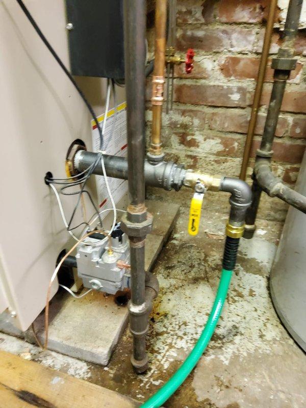 Performed scheduled maintenance tune-up on aging boiler system. Inspected all components including copper and metal piping, valves, and control assembly. Noted significant corrosion and rust on horizontal metal pipe requiring future attention, though system is currently operational. Customer confirmed and was present during service.