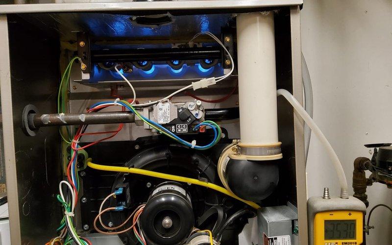 Performed comprehensive winter maintenance on two 9-year-old furnaces. Inspected flame patterns and electrical connections, confirming proper burner operation with clean blue flames. All components functioning correctly with no issues detected; system is operating within manufacturer specifications.