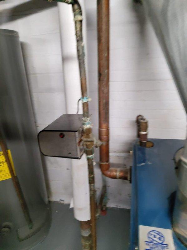 Performed scheduled maintenance on boiler radiator heating system. Inspected burner assembly showing proper flame pattern and checked all copper piping connections and control unit for functionality. System is operating normally with no issues detected.