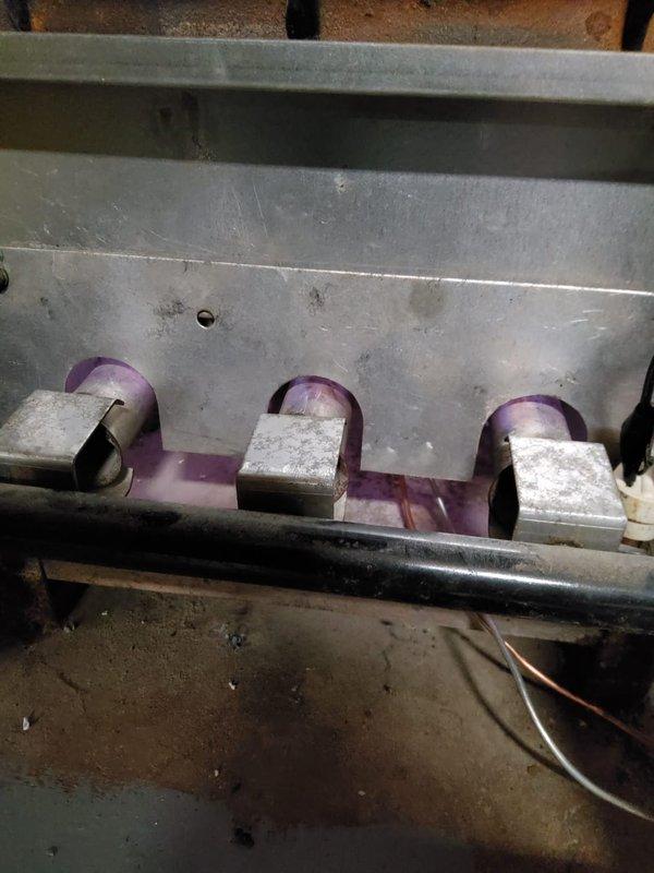 Performed scheduled maintenance on boiler radiator heating system. Inspected burner assembly showing proper flame pattern and checked all copper piping connections and control unit for functionality. System is operating normally with no issues detected.