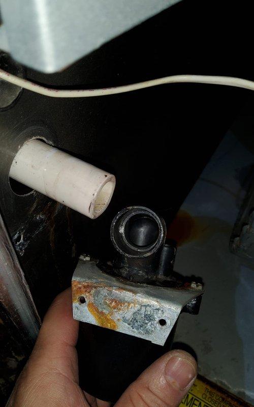 Performed diagnostic inspection on furnace with reported water leak. Identified severe rust and corrosion on internal metal bracket, likely source of the leak. Inspection of control panel revealed possible moisture intrusion with visible corrosion along housing edges. Previous blower motor replacement by technician Derek L. noted.