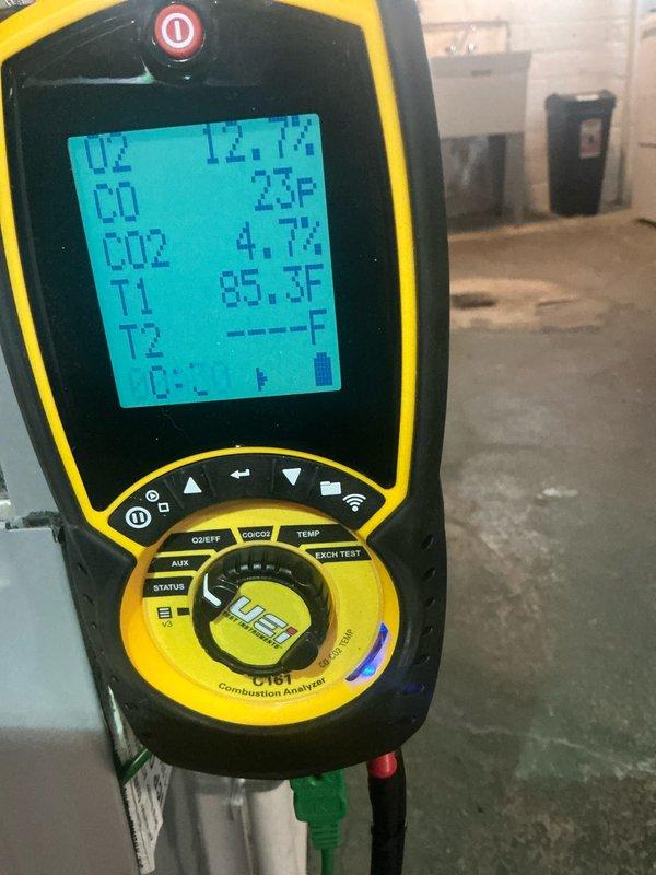 Performed routine furnace maintenance service including combustion analysis, which showed normal O2 (12.7%), CO2 (4.7%), and zero CO emissions. Inspected burner assembly and control wiring connections for proper operation.