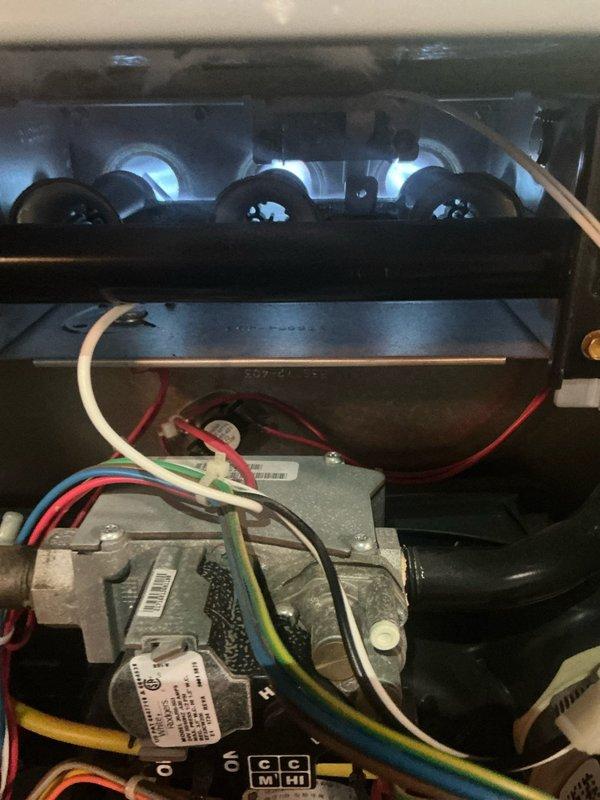 Performed routine furnace maintenance service including combustion analysis, which showed normal O2 (12.7%), CO2 (4.7%), and zero CO emissions. Inspected burner assembly and control wiring connections for proper operation.