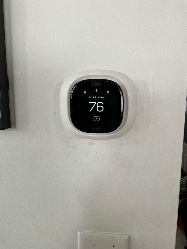 Completed full HVAC system replacement including installation of new Bryant furnace with PVC ventilation system, evaporator coil, air conditioning unit, and smart thermostat (showing 76°F with 31% battery). Additional components installed include model 1210 humidifier, air base, and 4" liner for improved system performance and air quality.