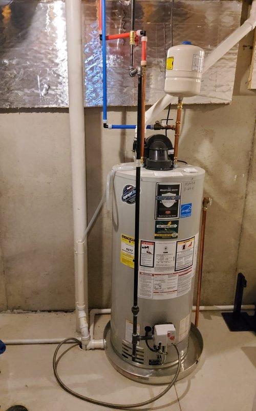 Conducted scheduled gas furnace maintenance with MVP service. Inspected equipment showing signs of wear on metallic components and ventilation structures. System appears to be functioning adequately despite surface imperfections and dust accumulation on components.