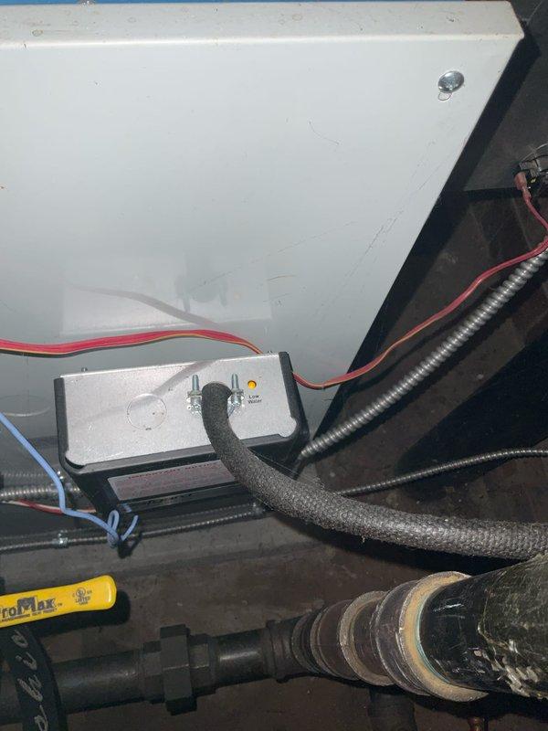 Completed scheduled boiler tune-up service on 7-year-old system. Inspected water level gauge assembly and control wiring connections. System operating within normal parameters; no issues identified during preventative maintenance.