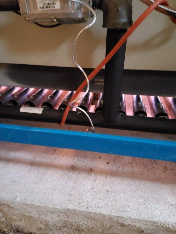 Performed annual heating tune-up on residential boiler system. Inspected copper heat exchanger components, checked all connections including control unit and wiring. Examined hot water heater, expansion tank, and associated copper piping system with no issues found. All components functioning properly with no leaks detected.