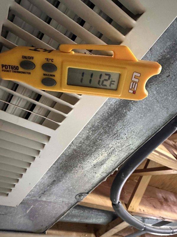 Replaced complete blower assembly including wheel, brackets, motor and capacitor on unit that had been inoperable for 13 days. Temperature readings confirmed successful restoration of heating function, with supply air temperature measuring 111.2°F and return air temperature at 59.9°F.