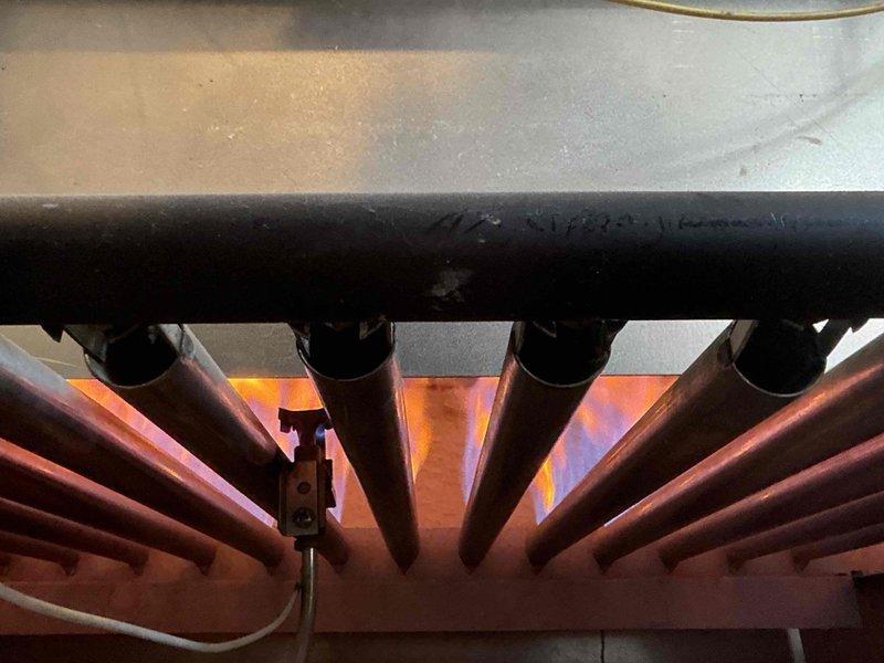 Performed scheduled maintenance on HP Commercial Steam Boiler. Inspected heat exchanger tubes and burner assembly, confirming proper operation with even flame distribution. Checked boiler stack arrangement and verified structural integrity of all components.