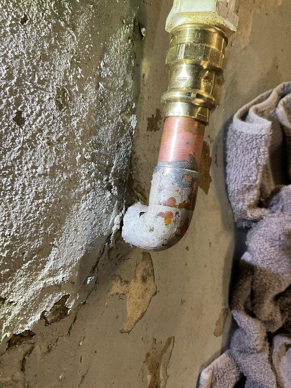 Responded to a service call regarding water leakage from a broken humidifier discharge pipe. Upon inspection, identified corrosion at the brass coupling where the PVC pipe connects to the copper line. Repaired the damaged connection and verified proper water flow with no further leakage from the system.