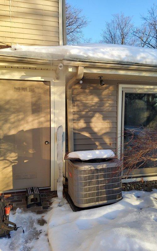 Performed scheduled heating tune-up service on two heat pump furnace systems and water heater per home maintenance plan. Inspected outdoor heat pump unit showing proper installation with no visible damage despite winter conditions. Examined indoor air handler/furnace unit in basement, confirming proper operation with all ductwork connections secure and system functioning within normal parameters.