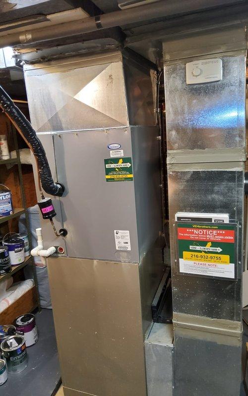 Performed scheduled heating tune-up service on two heat pump furnace systems and water heater per home maintenance plan. Inspected outdoor heat pump unit showing proper installation with no visible damage despite winter conditions. Examined indoor air handler/furnace unit in basement, confirming proper operation with all ductwork connections secure and system functioning within normal parameters.