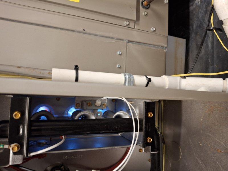Performed scheduled heating system tune-up and conducted comprehensive diagnostic testing with UEi analyzer to verify proper combustion parameters. Inspected PVC venting system for secure connections and proper installation. Confirmed normal blue flame pattern in burner assembly, indicating efficient operation with no combustion issues detected.