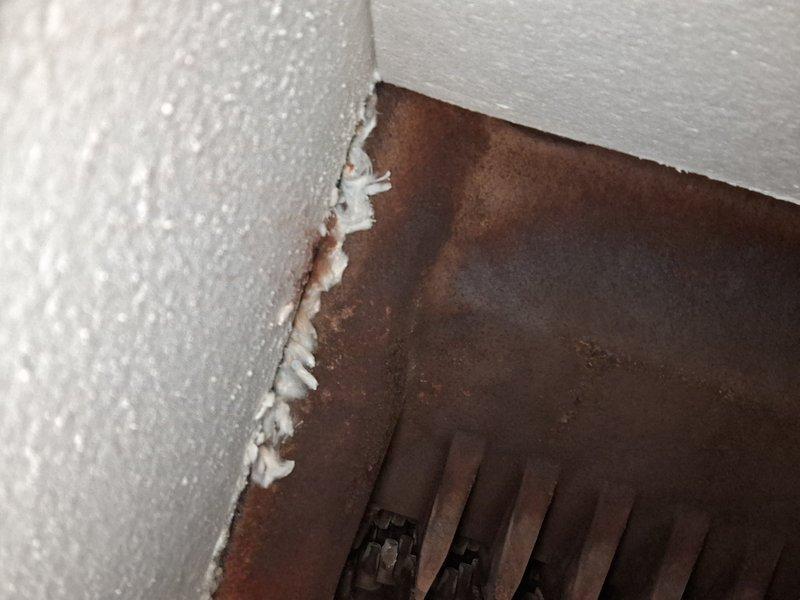 Performed scheduled maintenance on 10-year-old steam boiler system. Identified significant corrosion on heat exchanger components and venting, with extensive rust development on metal surfaces. Documented deteriorating seals at wall/vent junction requiring attention during next service visit.