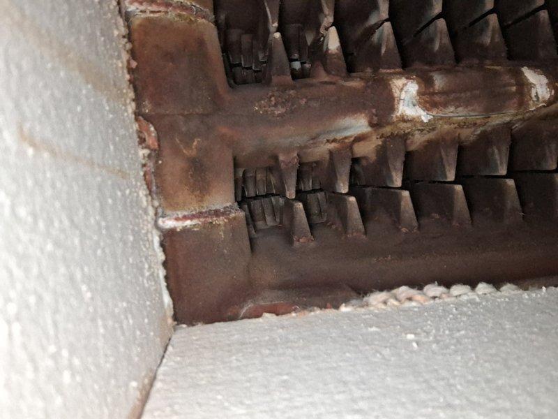 Performed scheduled maintenance on 10-year-old steam boiler system. Identified significant corrosion on heat exchanger components and venting, with extensive rust development on metal surfaces. Documented deteriorating seals at wall/vent junction requiring attention during next service visit.