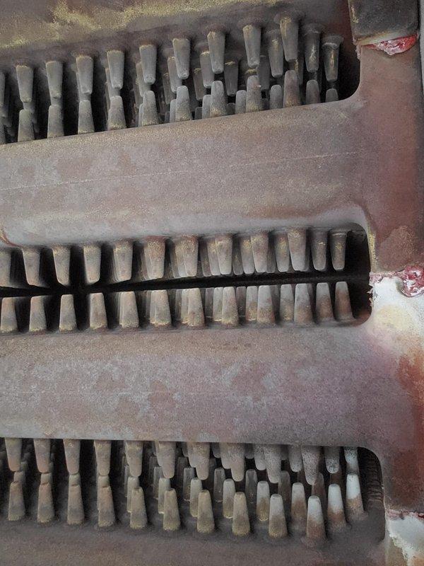Performed routine maintenance on 12-year-old boiler system. Inspected burner assembly and confirmed proper flame pattern with consistent blue flames across all ports. Examined heat exchanger which showed normal wear with some surface oxidation and minor mineral deposits, but remains functionally sound without any safety concerns.