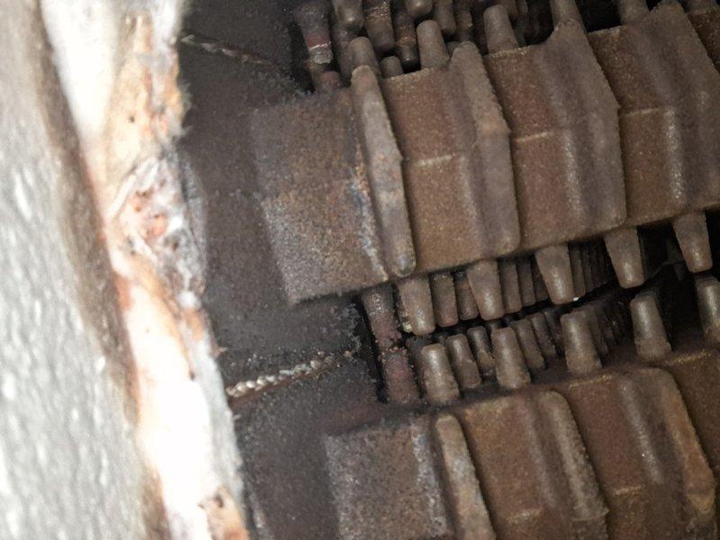 Performed scheduled maintenance on steam boiler system per national maintenance program. Inspected heat exchanger segments for proper alignment and condition. Documented current state of refractory tiles showing normal wear pattern with no immediate concerns requiring replacement.