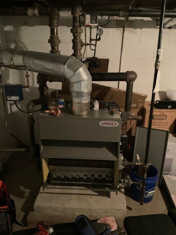 Completed annual maintenance service on Lennox gas steam boiler. Inspected copper supply lines, valves, and connections for proper operation and signs of oxidation. Examined furnace ductwork, associated plumbing components, and verified proper system function as part of scheduled tune-up service.