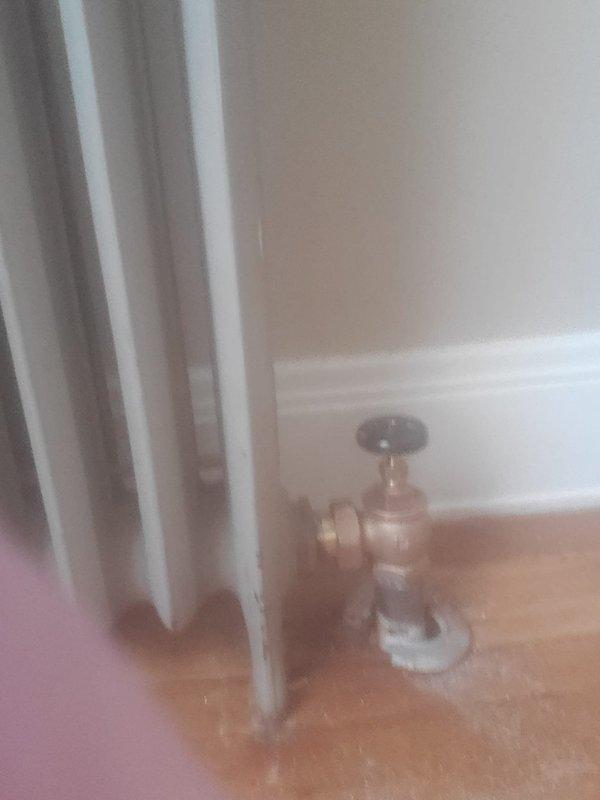 Installed pressure relief valve on existing boiler system for new homeowner. Inspected radiator connections and verified proper operation of the heating system after installation. Equipment appears to be functioning normally despite unknown age.