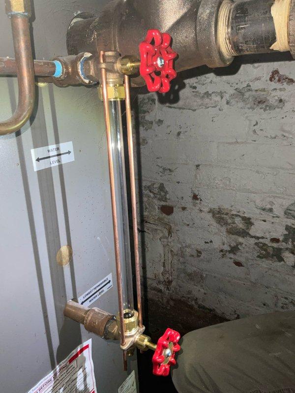 Responded to service call for a leaking boiler system. Inspected and replaced broken sight glass that had previously failed. Installed new brass shut-off valves on the copper pipe assembly to restore proper functionality to the 16-year-old unit that was originally installed in 2010.