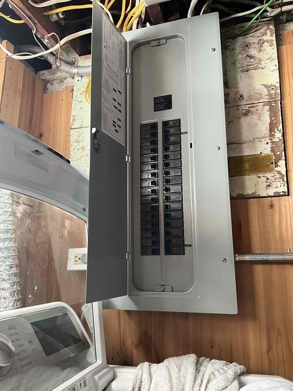 Performed diagnostic assessment on non-functional boiler system estimated to be 3-5 years old. Inspection revealed electrical connectivity issues at the circuit breaker panel and deteriorating condition of the heating unit. Documentation included photographic evidence of the electrical panel configuration and the existing boiler installation with associated piping network for comprehensive evaluation and replacement planning.