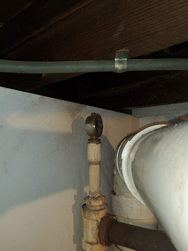 Diagnosed and repaired leaking return pipe vent on 7-year-old Williamson steam gas boiler. Inspection of burner assembly showed proper flame pattern and operation. Replaced damaged pipe fitting to resolve leak issue and restore system to normal operating condition.