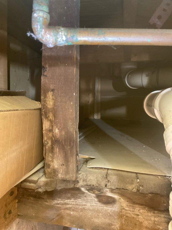 Diagnosed and repaired leaking toilet that was causing water damage through ceiling. Identified compromised fittings in the copper supply line and damaged PVC drainage P-trap in the crawlspace. Replaced affected plumbing components, resolving both the toilet leak and addressing the kitchen sink drainage issue below.