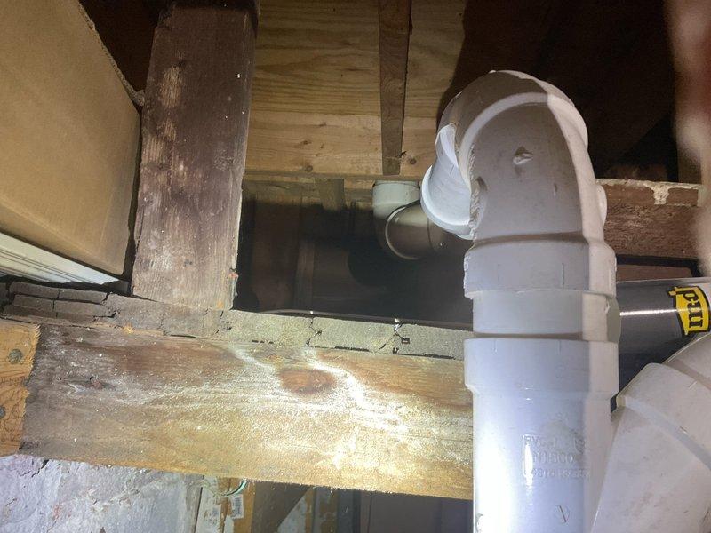 Diagnosed and repaired leaking toilet that was causing water damage through ceiling. Identified compromised fittings in the copper supply line and damaged PVC drainage P-trap in the crawlspace. Replaced affected plumbing components, resolving both the toilet leak and addressing the kitchen sink drainage issue below.