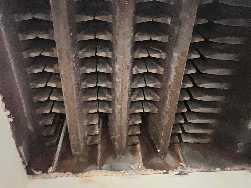 Performed scheduled maintenance on 11-year old MVP steam boiler system. Inspection revealed significant dust accumulation and possible corrosion on heating coils, with burner assembly showing normal flame pattern during operation. Cleaned heat exchanger fins and verified proper combustion sequence.