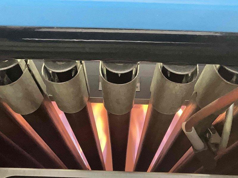 Performed scheduled maintenance on 11-year old MVP steam boiler system. Inspection revealed significant dust accumulation and possible corrosion on heating coils, with burner assembly showing normal flame pattern during operation. Cleaned heat exchanger fins and verified proper combustion sequence.