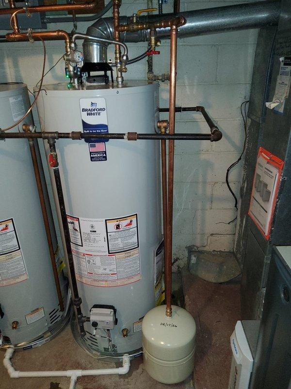 Successfully installed a water hammer shock arrestor and upgraded the expansion tank to a larger size to improve system performance and reduce water pressure fluctuations. All necessary parts were obtained from shop inventory prior to 8am arrival time, and installation was completed with proper connections to the existing Bradford White water heater system.