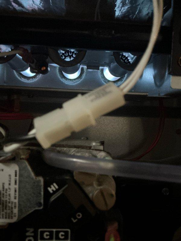 Performed routine maintenance on two heating systems, inspecting burner assemblies and flame patterns which showed proper blue-white ignition. Checked all electrical connections including control module wiring harnesses, ensuring secure contacts and proper functionality of all components.