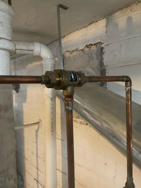 Performed annual maintenance service on steam boiler system per Home Plan Heating Tune Up agreement. Inspected and verified proper operation of pressure regulator valve and backflow prevention components. Checked all copper supply lines and PVC condensate piping for leaks and proper installation; all components found to be in good working condition.