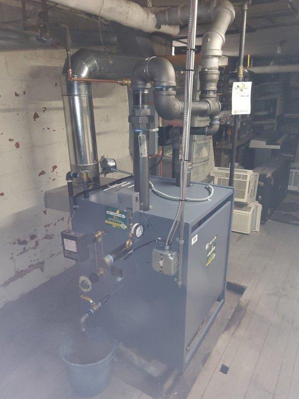 Successfully replaced an aging Weil-McLain steam boiler system in basement mechanical room, including installation of new boiler feed pump (BFP), water feeder, and thermostat. System was properly connected to existing piping infrastructure with all connections tested to ensure proper operation and efficiency of the new heating equipment.
