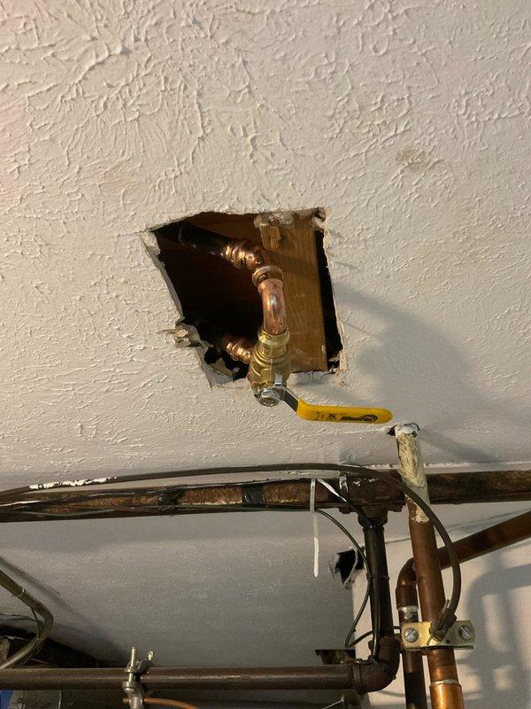 Completed multiple plumbing repairs requiring water company shutoff coordination. Installed new shutoff valve on copper supply line accessed through ceiling opening, and serviced water heater control unit with status light code functionality. Obtained required state technical support approval through Edlemans for comprehensive repair work.