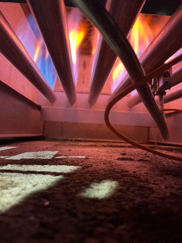 Performed annual tune-up on MVP12-4 boiler system, inspecting burners and heat exchanger. Verified proper flame pattern with good blue-orange coloration indicating efficient combustion. Heat exchanger surfaces showed normal wear with no concerning corrosion or cracks that would affect operation.