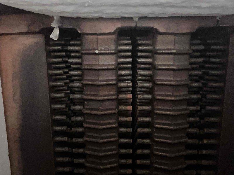 Performed annual tune-up on MVP12-4 boiler system, inspecting burners and heat exchanger. Verified proper flame pattern with good blue-orange coloration indicating efficient combustion. Heat exchanger surfaces showed normal wear with no concerning corrosion or cracks that would affect operation.