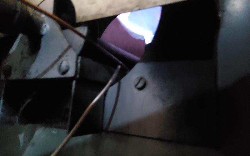 Performed routine maintenance on Heatmaker furnace system located in basement utility area. Conducted comprehensive inspection of belt-driven unit, checking flame pattern and internal components for proper operation. System is functioning correctly with no immediate issues identified; customer advised about maintenance plan renewal options.