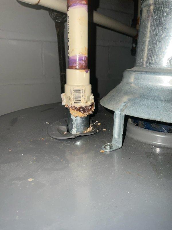 Completed installation of new gas line emergency shut-off valves for hot water heater, replacing deteriorated components. Identified and addressed corrosion at PVC pipe connection point where visible mineral buildup indicated an active leak. Installed Gastite-branded yellow handle valves on horizontal pipe sections with appropriate emergency shut-off tags for future reference.