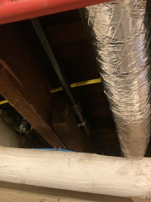 Completed relocation of gas and water supply lines in kitchen area to accommodate customer's remodeling project involving refrigerator and stove repositioning. Accessed utility space to properly route yellow gas line and metal water pipes through the crawlspace. Performed pressure test on completed gas line installation to verify system integrity and ensure no leaks were present.