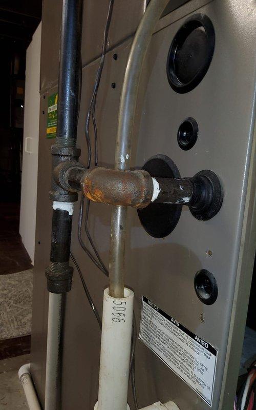 Performed inspection on 13-year-old York furnace after buyer's inspection noted gas odor near regulator in upper cabinet. Located and repaired significant corrosion and rust at gas line connection point. System now operating safely with no gas leaks detected.
