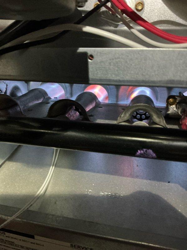 Performed scheduled heating system maintenance under Home Plan. Inspected gas burners and verified proper flame pattern with clean blue flames. Examined and cleaned blower wheel assembly to ensure optimal airflow. System is operating within manufacturer specifications.