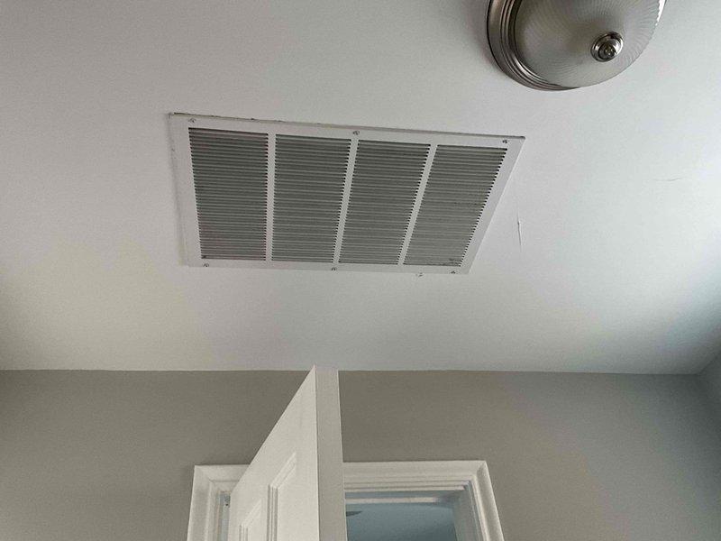 Performed second opinion inspection of HVAC system to address temperature inconsistency concerns between floors. Evaluated ductwork configuration and airflow distribution from single air handler serving multiple levels. Documented existing installation including ceiling registers and previous modifications where steam boiler coil was removed.